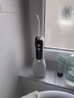 Customer photo: Hetrios Water Flosser on a bathroom windowsill
